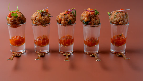Elegantly presented canapés on a styled tray at a reception