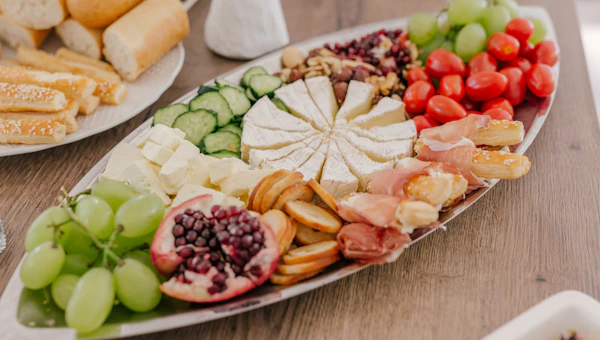 Beautiful grazing table with artisan cheeses and seasonal produce