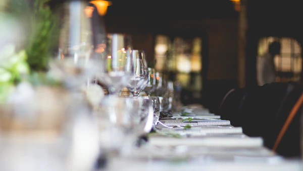 Elegant seated dining setup with plated course
